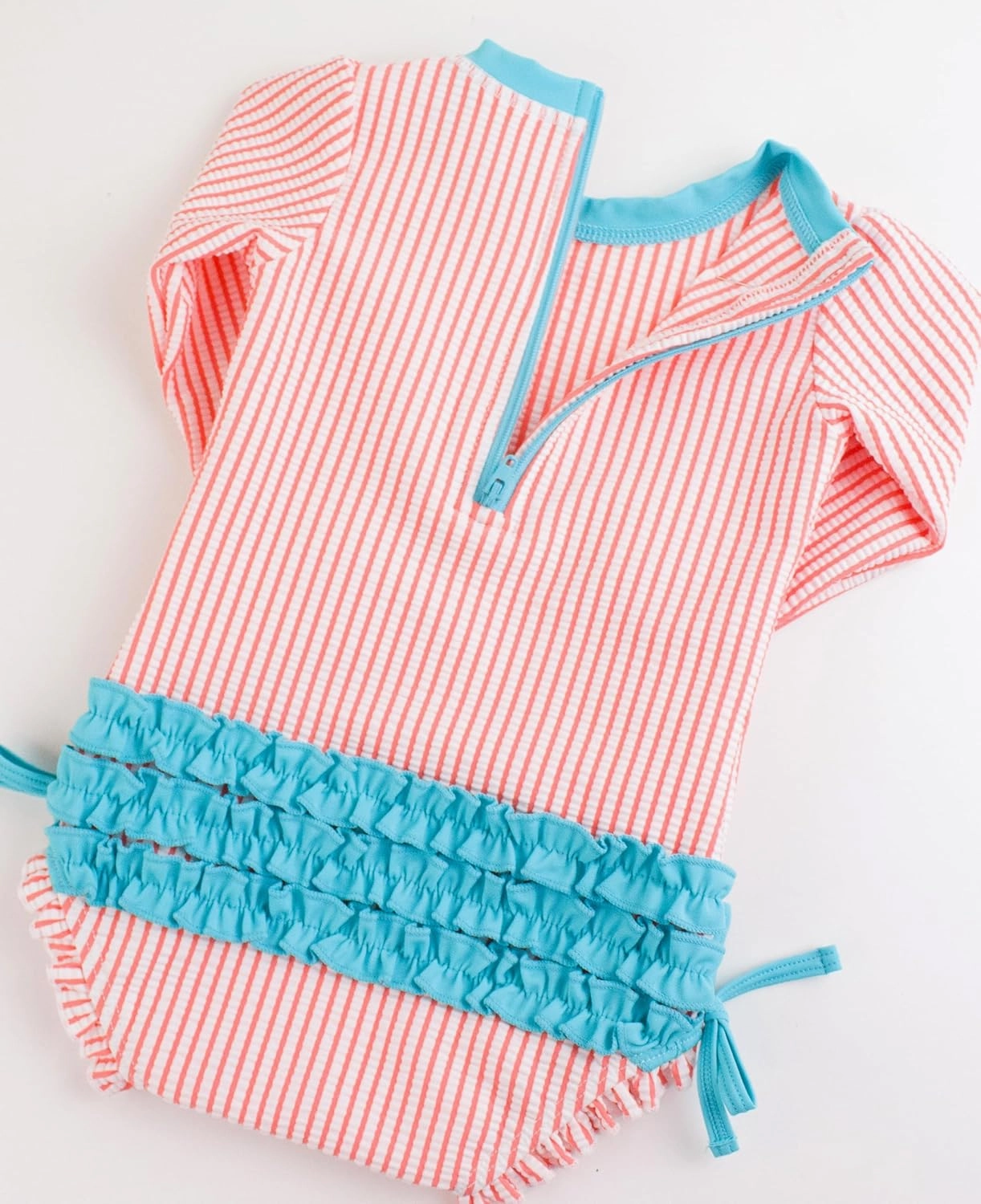 RuffleButts Baby/Toddler Girls Seersucker Long Sleeve One Piece Rash Guard Swimsuit with UPF 50  Sun Protection